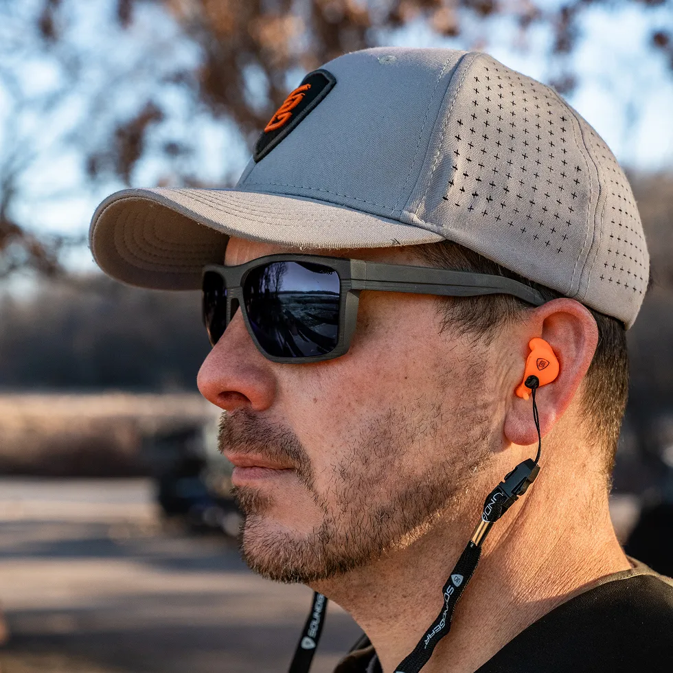 a man outside wearing SoundGear Earmolds