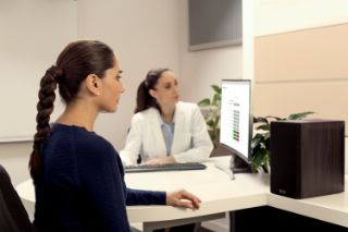 A senior couple on a pier feeding the seagulls